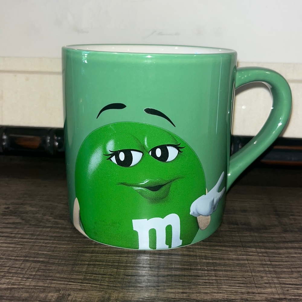 M&M’s Green ‘Lady’ coffee mug. “EAT YOUR Heart OUT, DARLING!’” Double Sided 2016